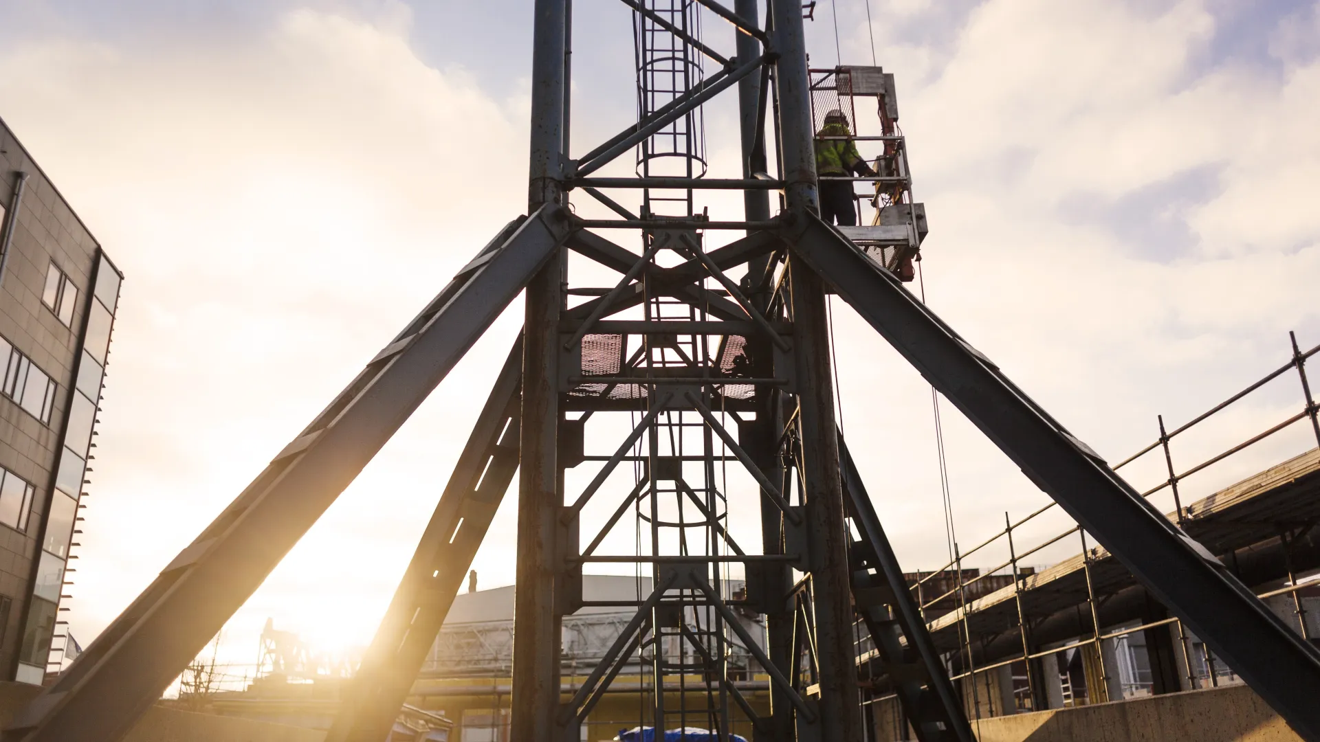 construction-workers-high-up-on-a-crane-against-a-2025-04-04-23-38-56-utc