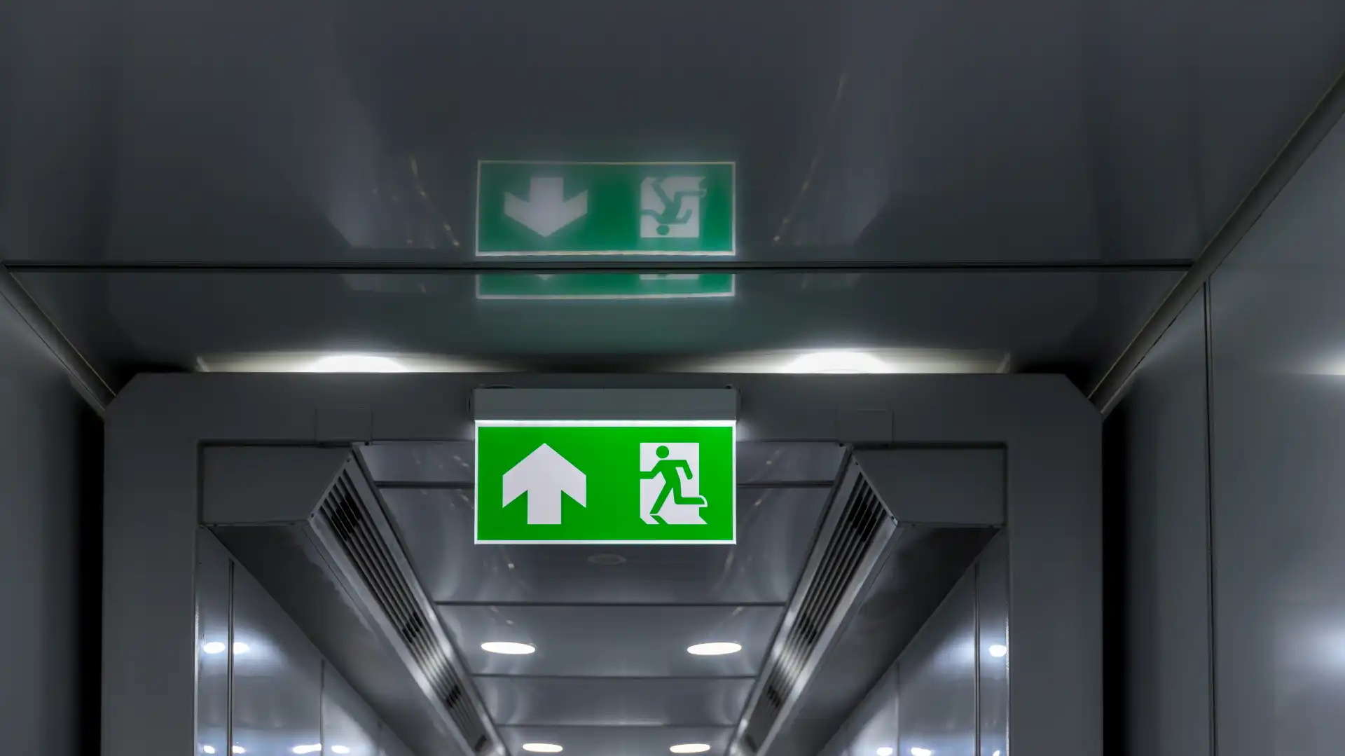 green-emergency-exit-sign-showing-the-way-to-escap-2025-03-15-15-27-00-utc