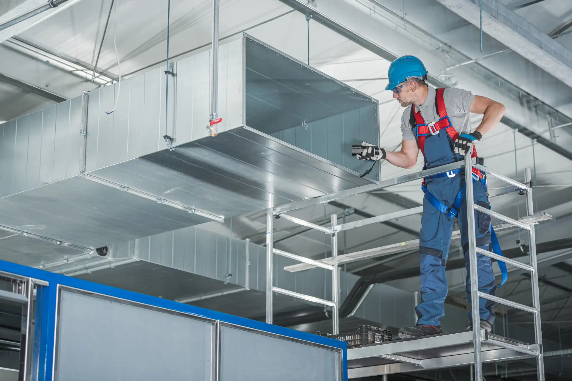hvac-technician-testing-newly-installed-warehouse-2025-03-16-20-03-41-utc